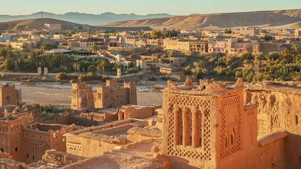 the view from kasbah ait benhaddou on the village beside it