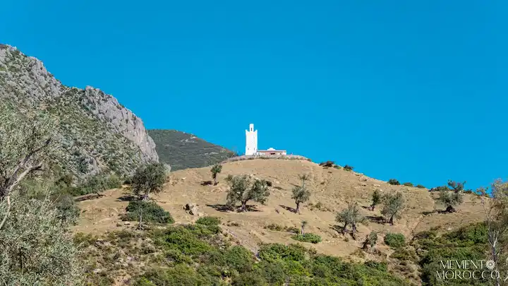 white mosque on top of a mountain in chefchaouen morocco