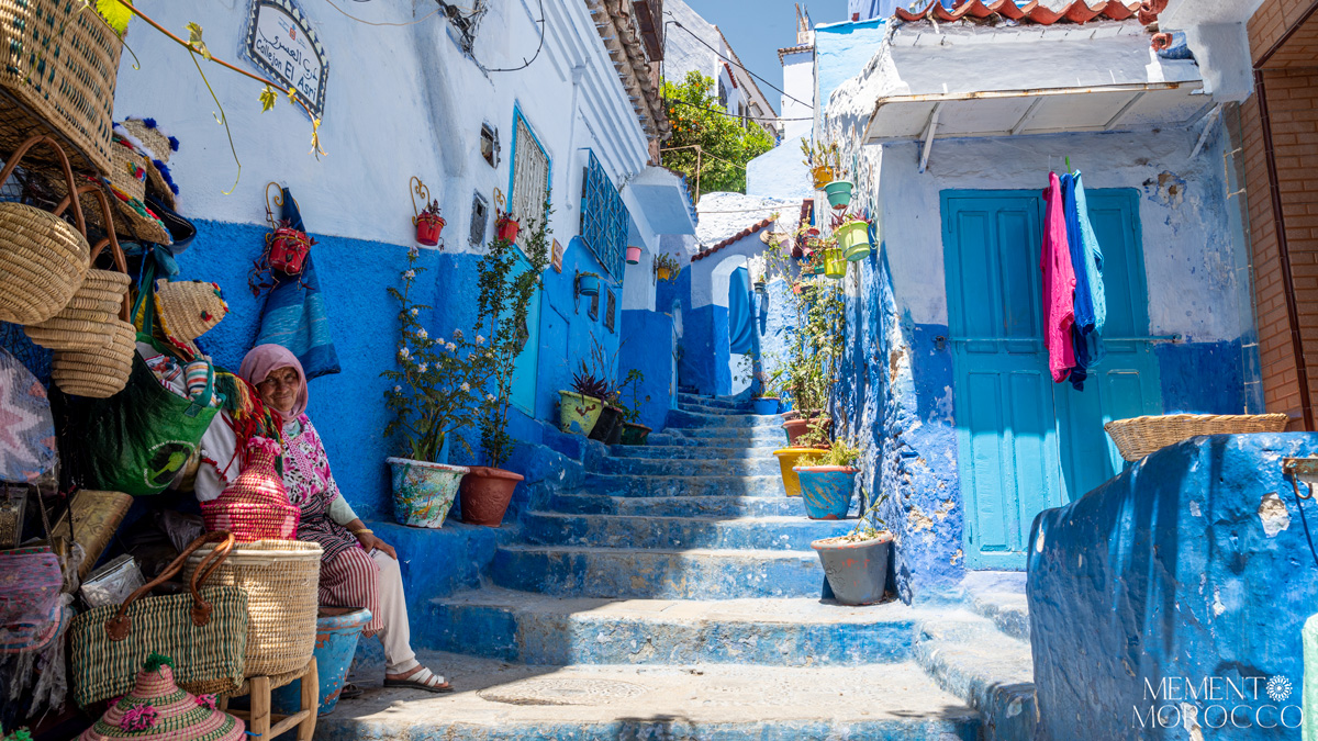 stairs with colorful flowers in chefchaouen city