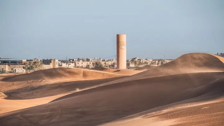 sand dunes and the city of merzouga