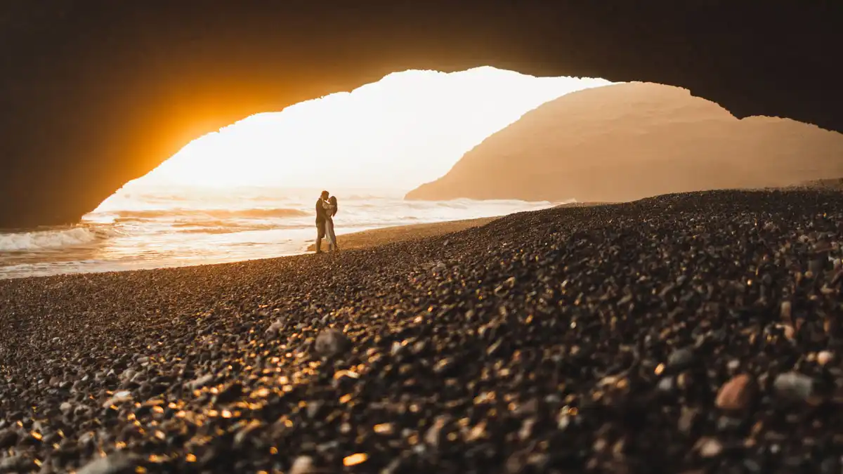 a couple enjoying the sunset at the beach in Agadir