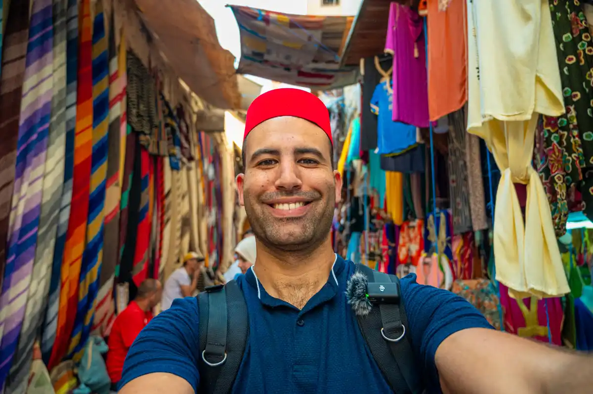 moroccan man in the vibrant souk of the medina in fez morocco