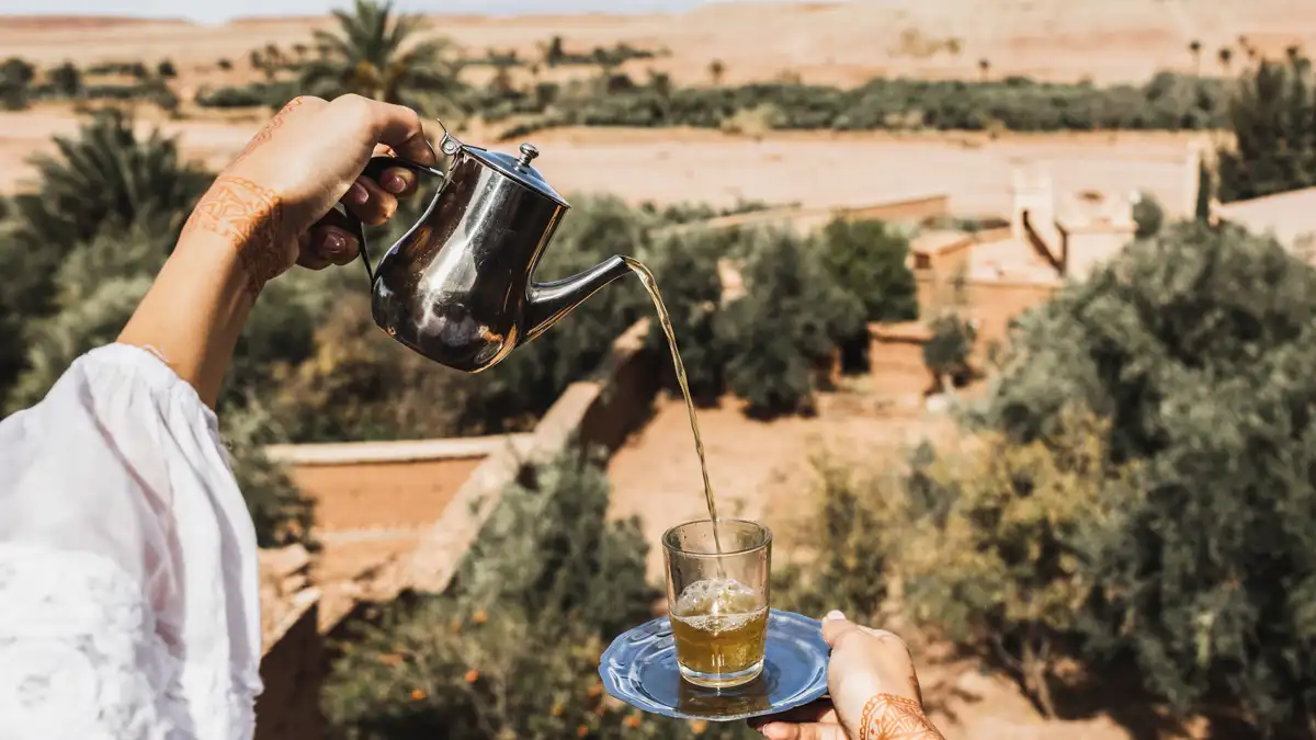 moroccan mint tea being served in the desert oases